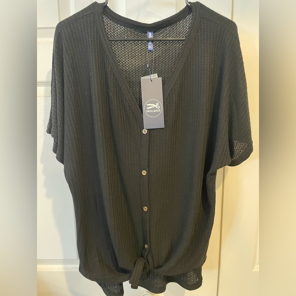 Women’s knit top with tie at bottom